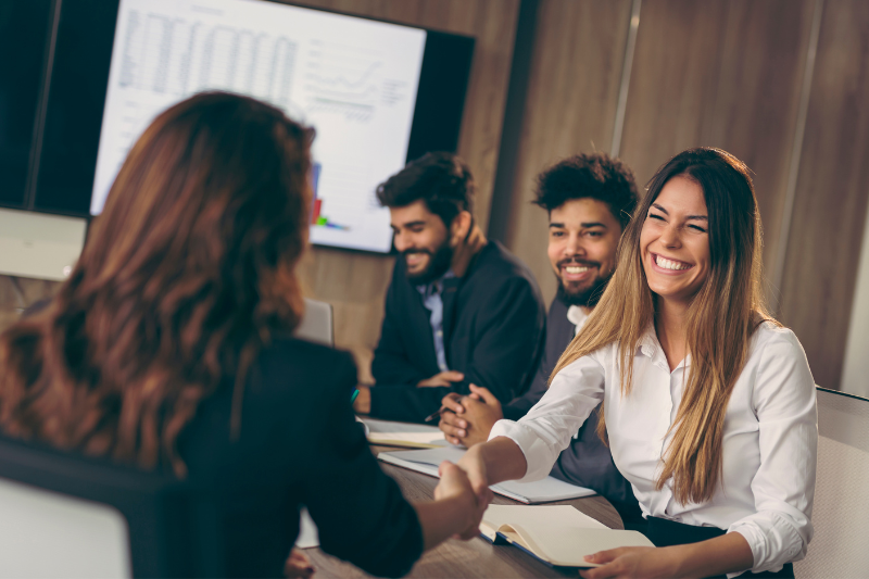 a group of people in an office meeting