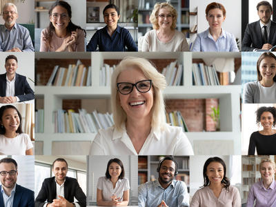 A diverse group of smiling people on a Zoom call screen