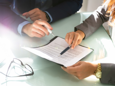 Image of people reviewing a document