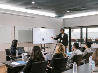 Office with a man presenting to people