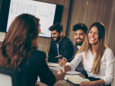 a group of people in an office meeting